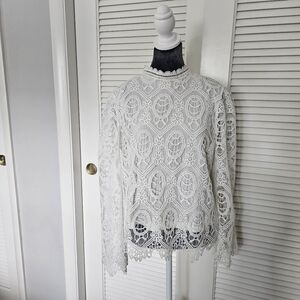 Ultra Pink bright white lace shirt with mock neck and long bell sleeve. Size L